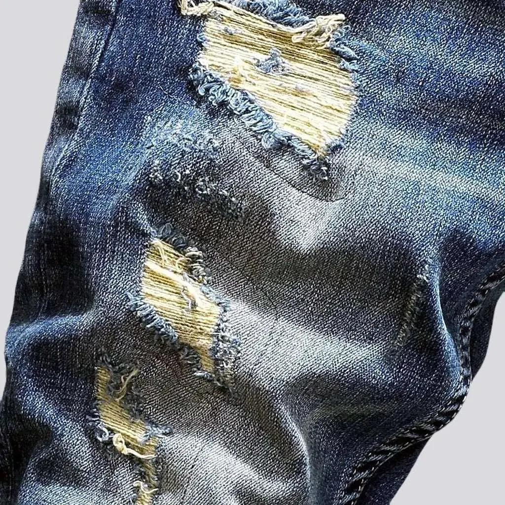 Distressed men's street jeans