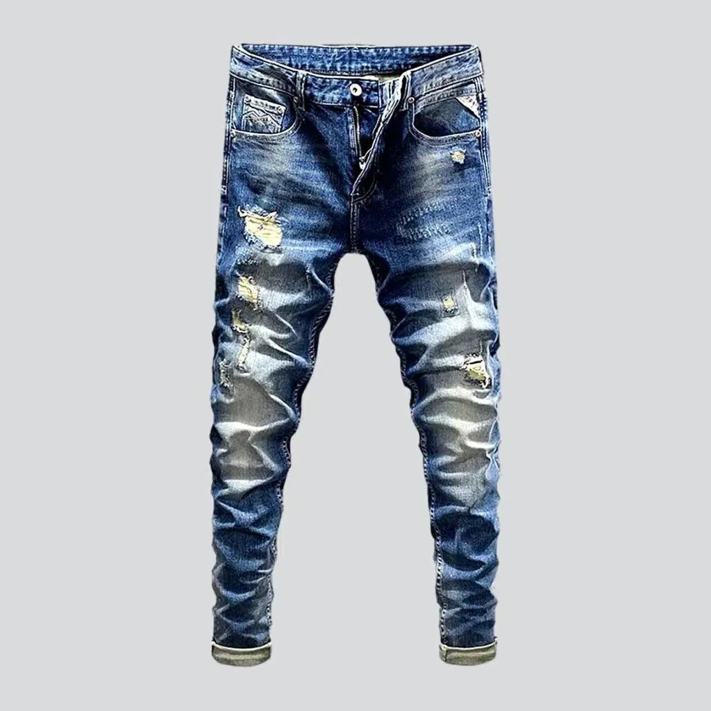 Distressed men's street jeans